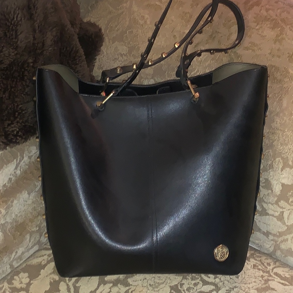 Vince Camuto Black Leather purse with gold plates . Excellent condition